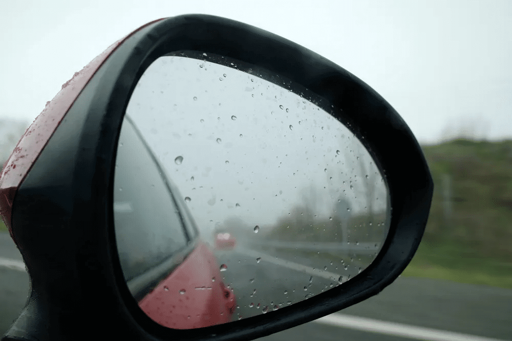 car in rainy weather affecting blind spot sensor