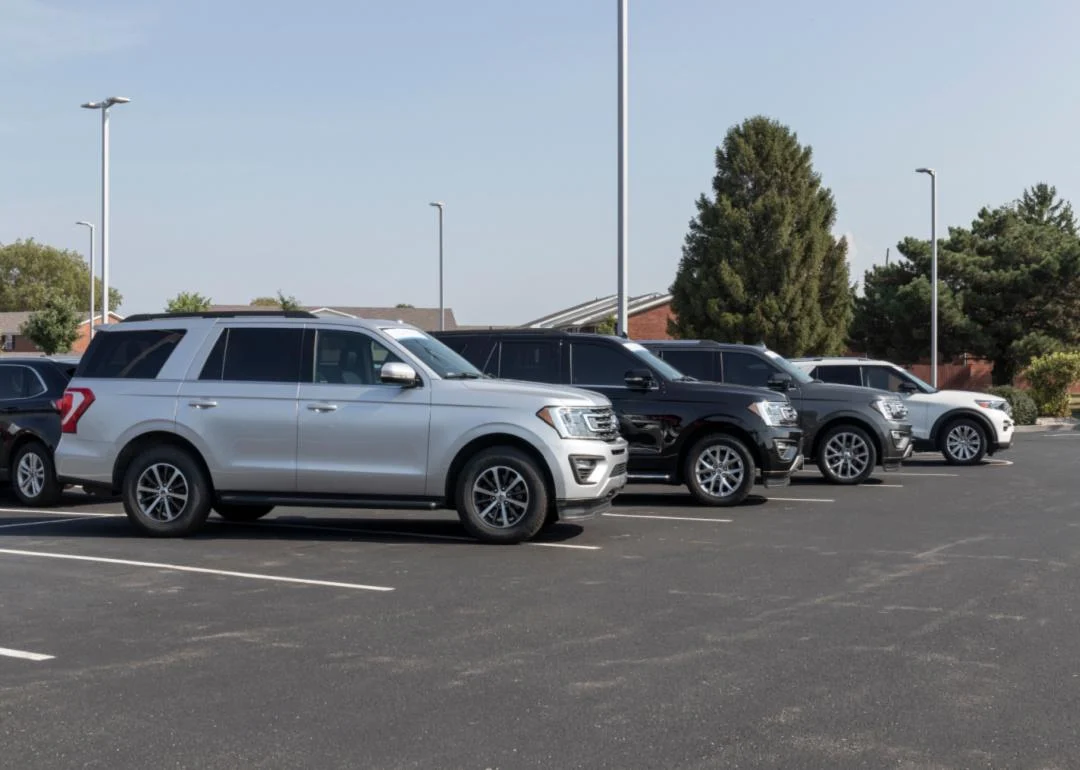 a silver ford expedition in a parking lot.