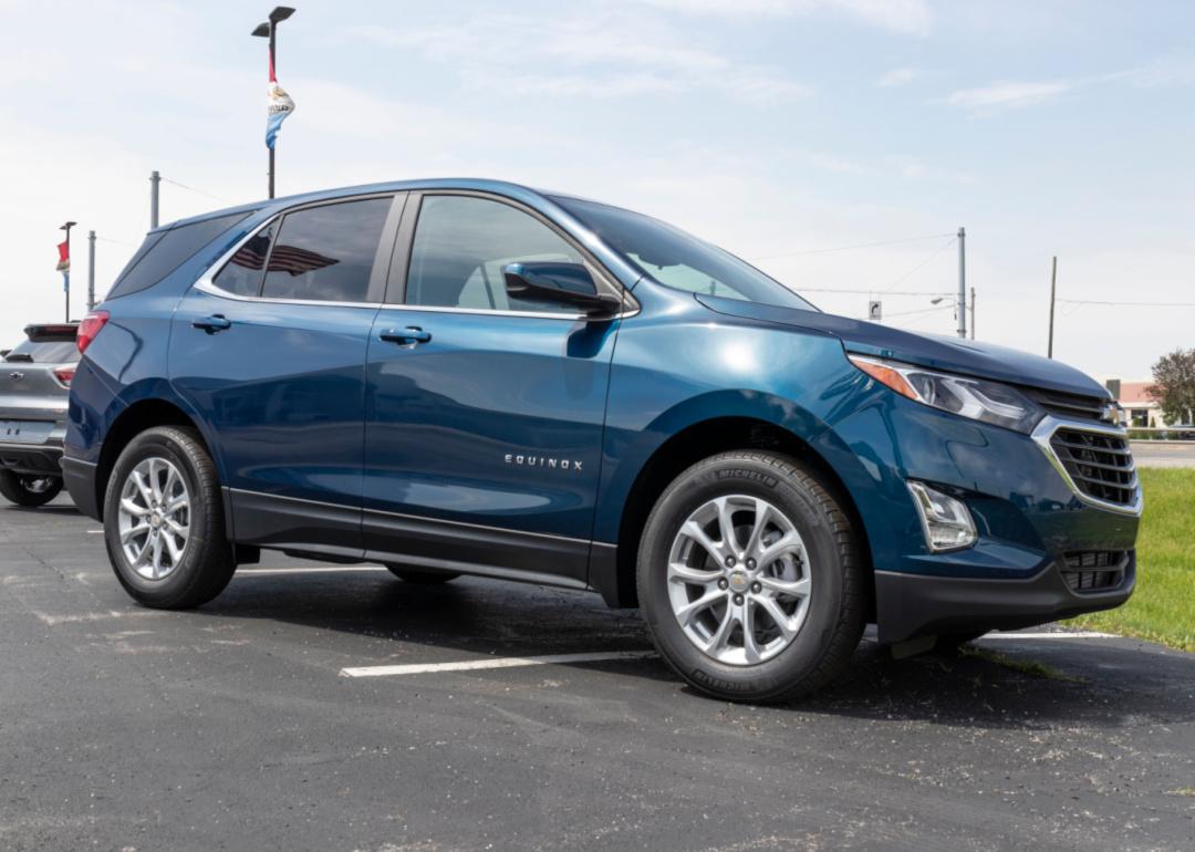 a white chevrolet traverse on display at a dealership.